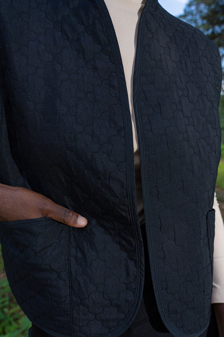Woman Quilting Black Vest