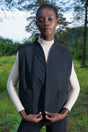 Woman Quilting Black Vest