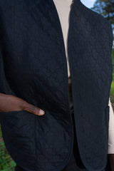 Woman Quilting Black Vest
