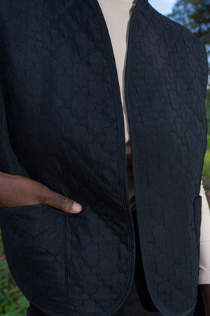 Woman Quilting Black Vest